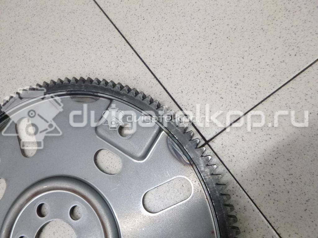 Фото Маховик для двигателя QR25DE для Nissan (Dongfeng) / Suzuki / Mitsuoka / Nissan 141-182 л.с 16V 2.5 л бензин 123313TU0A {forloop.counter}}