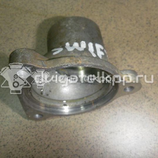 Фото Крышка термостата для двигателя M13A для Subaru / Suzuki / Chevrolet 82-94 л.с 16V 1.3 л бензин 1756163J00