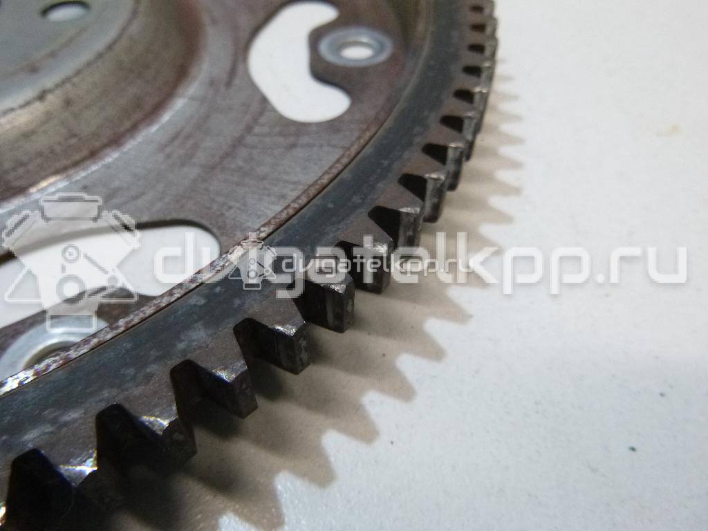 Фото Маховик для двигателя K12B для Suzuki / Mitsubishi / Vauxhall 86-94 л.с 16V 1.2 л бензин 2262073KR0 {forloop.counter}}