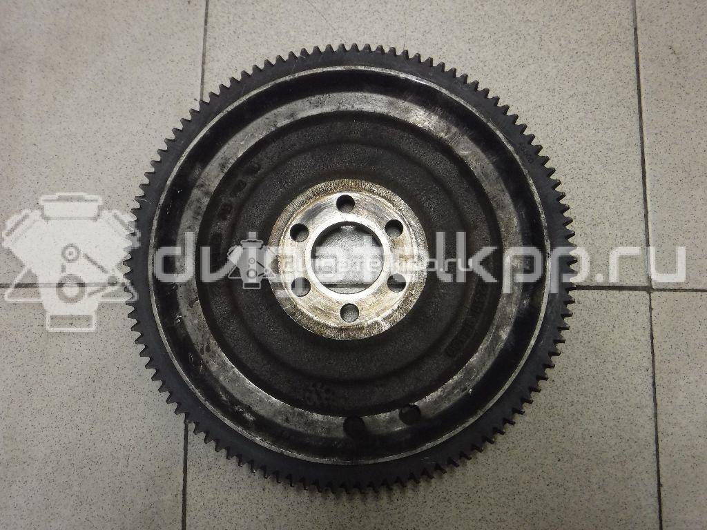 Фото Маховик для двигателя QG16DE для Nissan Sunny / Bluebird / Avenir / Primera / Almera 102-120 л.с 16V 1.6 л бензин 123119F600 {forloop.counter}}