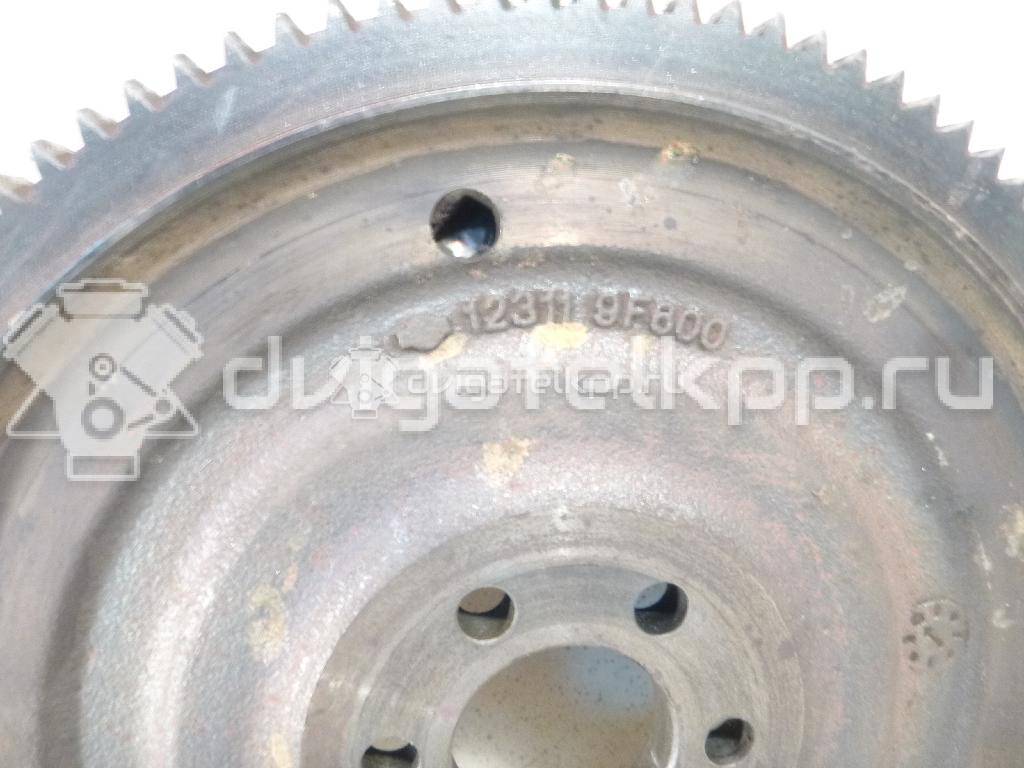 Фото Маховик для двигателя QG16DE для Nissan Sunny / Bluebird / Avenir / Primera / Almera 102-120 л.с 16V 1.6 л бензин 123109F700 {forloop.counter}}