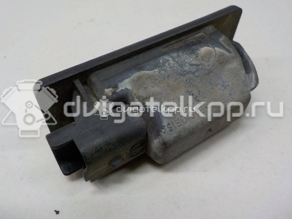 Фото Фонарь подсветки номера  26510AU300 для Nissan Primera / Micra / Note / Nv200 / Np300 {forloop.counter}}